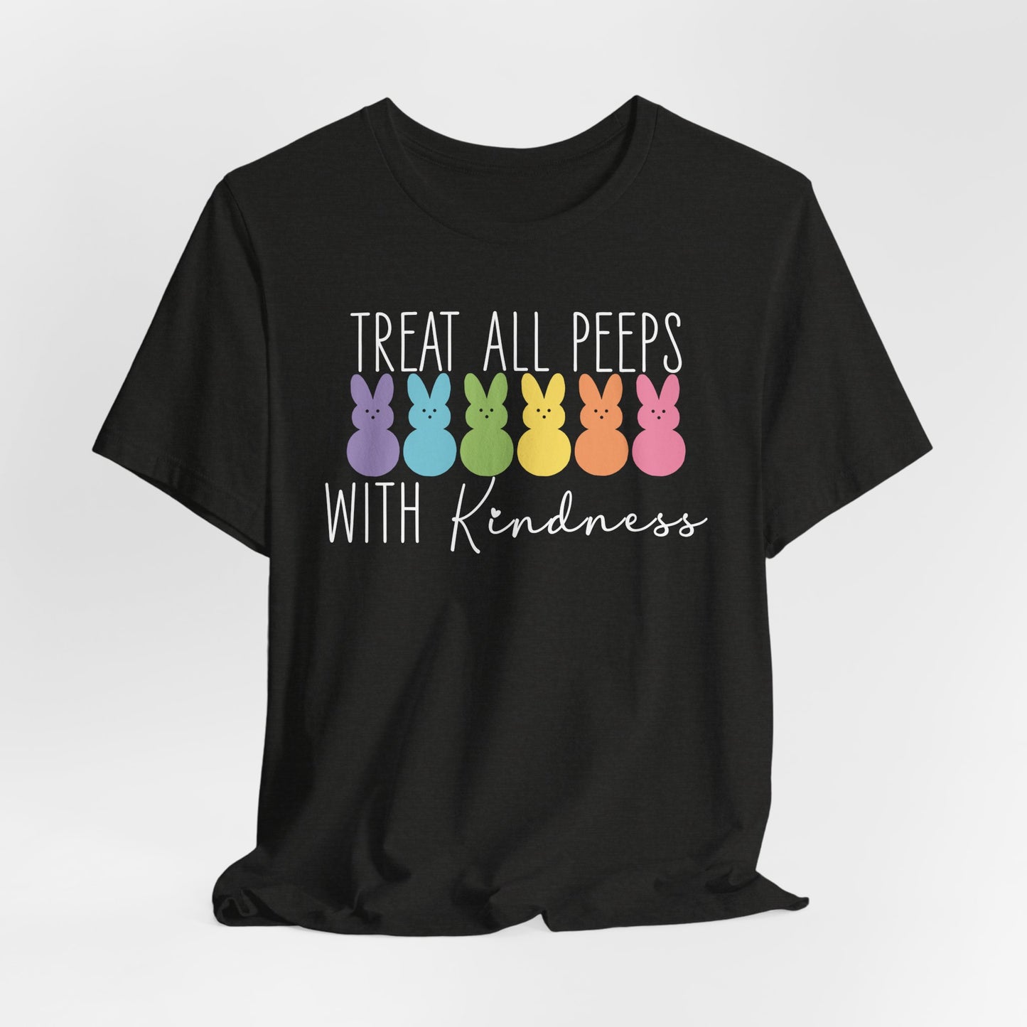 The Treat All Peeps With Kindness shirt, a fun Easter gift for teachers, features colorful bunny silhouettes in blue, purple, green, yellow, orange, and pink with uplifting text. This comfortable unisex tee is an ideal choice for spreading positivity.