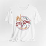 The Have The Day you Deserve Kindness Gift: Motivational Skeleton T-Shirt for Positive Vibes is a white unisex cotton tee with a skeleton hand thumbs-up, pastel hearts, and the phrase Have the day you deserve in a circular graphic.