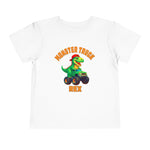 The Monster Truck Rex T-Shirt 🛻🦕 – Toddler Boys Tee features a cartoon green T-rex driving a monster truck, with orange MONSTER TRUCK text above and REX below—perfect for any toddler dinosaur shirt collection!.