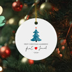 Personalized round Christmas ornament celebrating a couple's first Christmas married, featuring a festive Christmas tree, names, and the year 2024.
