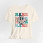 The Mama Print Crew Neck T-shirt is a soft beige Airlume cotton top for women, featuring MAMA in a colorful retro font repeated four times around a smiley face with heart patterns. Made in Fair Labor Association–certified facilities.