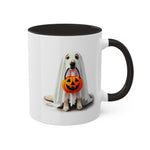 The Ghostly Pup Halloween Mug – Spooktacular Coffee Companion Colorful Mug, 11oz, features a dog dressed as a ghost with a pumpkin bucket in its mouth on a white mug with black handle and interior.