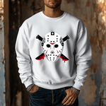 Wearing the Voorhees 13 Unisex Heavy Blend Crewneck, which features a hockey mask and bloody knives design, a person stands with hands in pockets against a rustic textured wall, enhancing the eerie vibe. Perfect for fans of iconic horror.