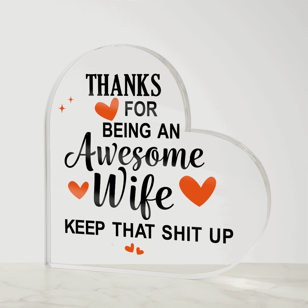 Heart-shaped acrylic plaque with a bold, humorous message thanking an awesome wife, accented with orange hearts.