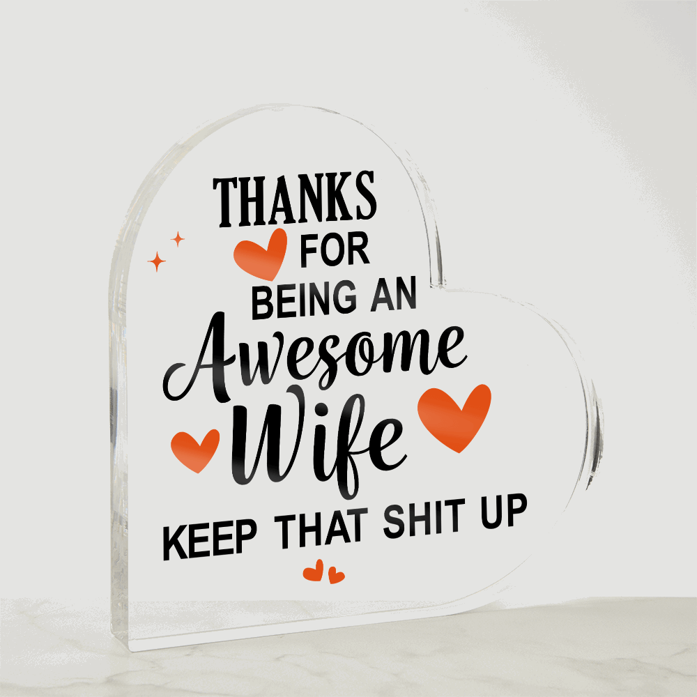 Heart-shaped acrylic plaque with a bold, humorous message thanking an awesome wife, accented with orange hearts.
