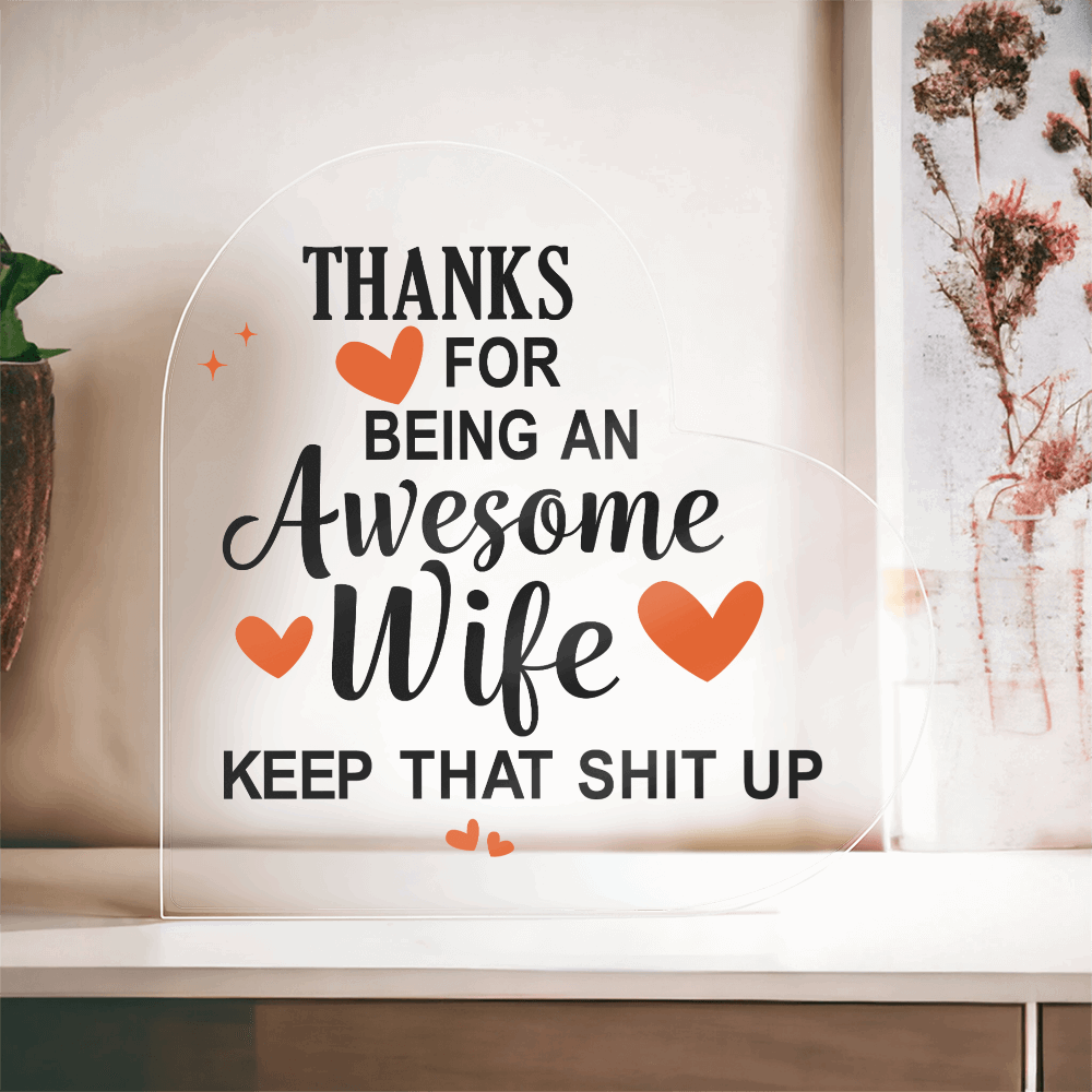 Heart-shaped acrylic plaque with a bold, humorous message thanking an awesome wife, accented with orange hearts.