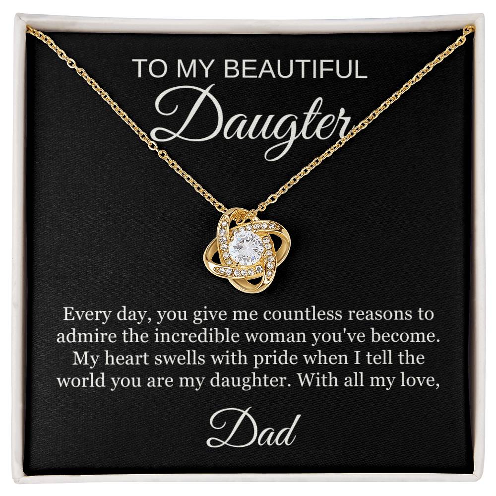 The To My Beautiful Daughter Love Knot Necklace features sparkling cubic zirconia in 14k white gold, displayed in a gift box with the message: “With all my heart, Dad.”.