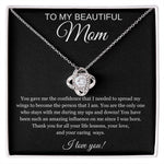 The “To My Beautiful Mom” Cubic Zirconia Love Knot Necklace is displayed in a gift box with a black message card background, perfect for Mothers Day or birthdays. The knot pendant sparkles, and the heartfelt note reads: I love you!.