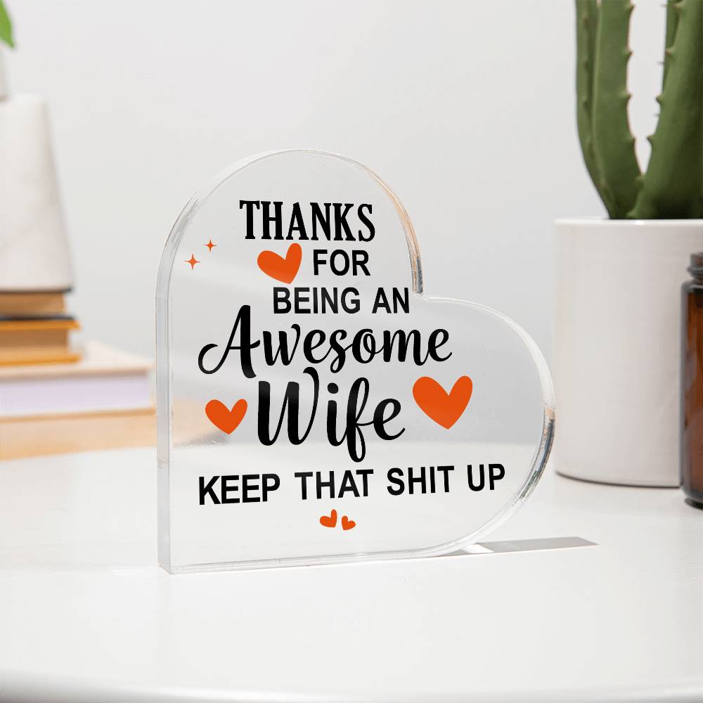 Heart-shaped acrylic plaque with a bold, humorous message thanking an awesome wife, accented with orange hearts.