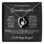 The To My Beautiful Granddaughter Forever Love Necklace, heart-shaped with a gold finish and cubic zirconia stone, comes in a black velvet gift box featuring a heartfelt message, symbolizing love and presence even when apart.