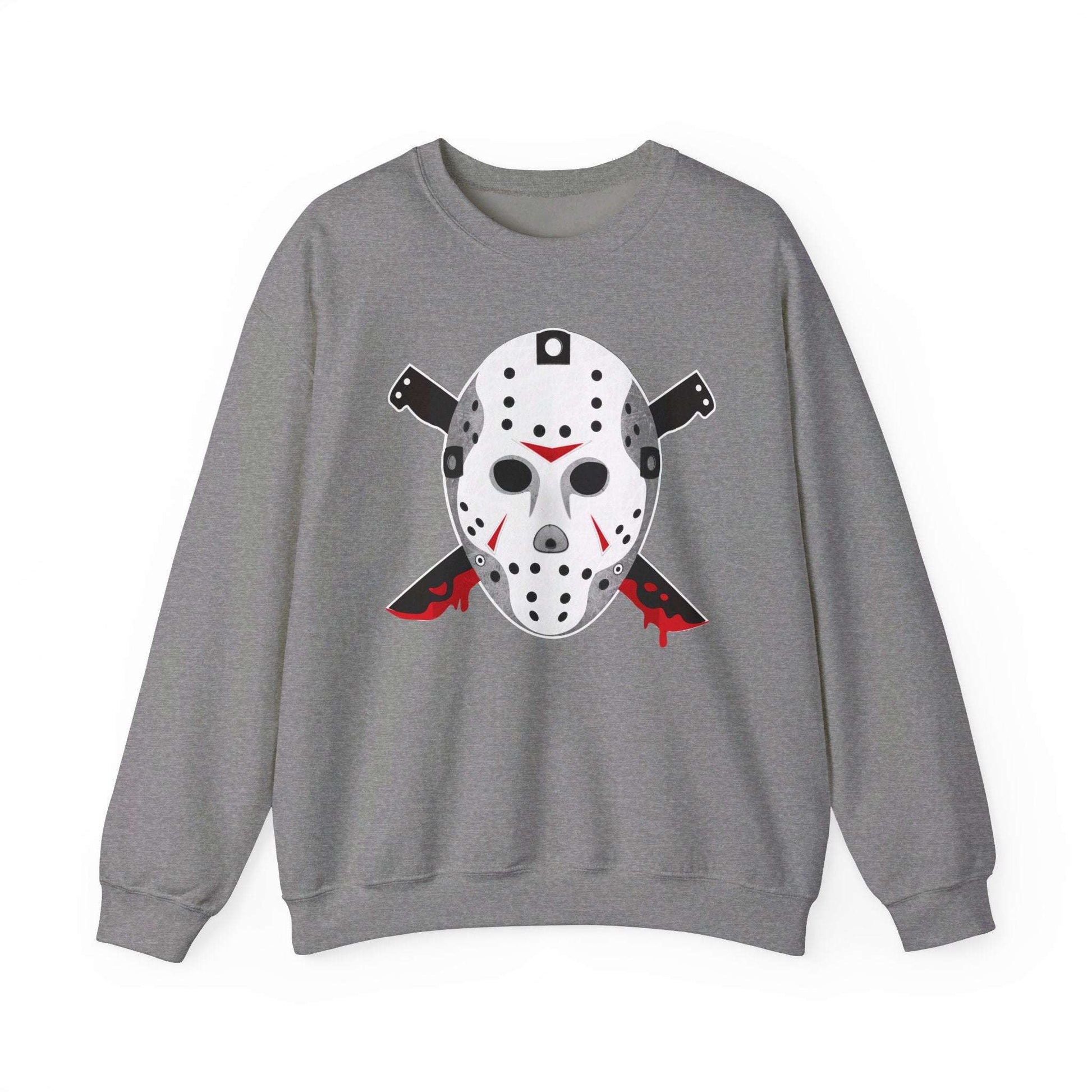 The Voorhees 13 sweatshirt, ideal for horror enthusiasts, features a gray design with a white hockey mask graphic and black-red details. Two red-accented knives are ominously crossed behind the mask on this unisex heavy blend crewneck.
