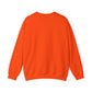 The Witches Brew Coffee Co. Stop in for a Spell! unisex heavy blend crewneck sweatshirt is vibrant orange, capturing Halloween vibes, and displayed from the back on a white background. Ideal for chilly evenings or enjoying coffee from Witches Brew.