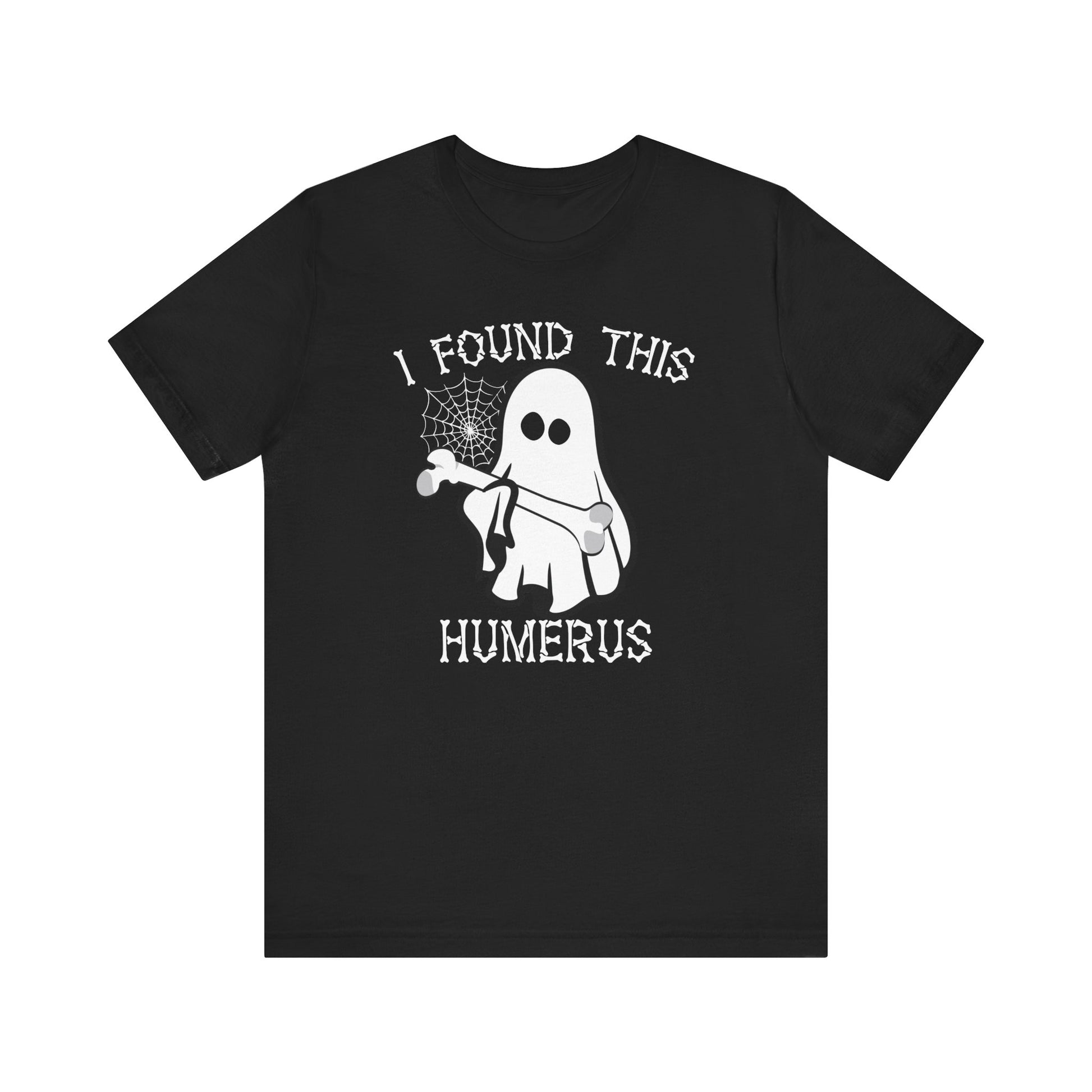 The I Found This Humerus - Funny Halloween Ghost T-Shirt features a playful ghost with a bone and spider web, plus the phrase I FOUND THIS HUMERUS in white letters—perfect for adding some spooky, punny fun to your Halloween!.
