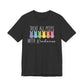 The Treat All Peeps With Kindness shirt is a black unisex tee featuring white and pastel text with six vibrant pastel bunny silhouettes in yellow, turquoise, purple, orange, blue, and pink—perfect as an Easter gift for teachers or as a cheerful addition to your Easter ensemble.