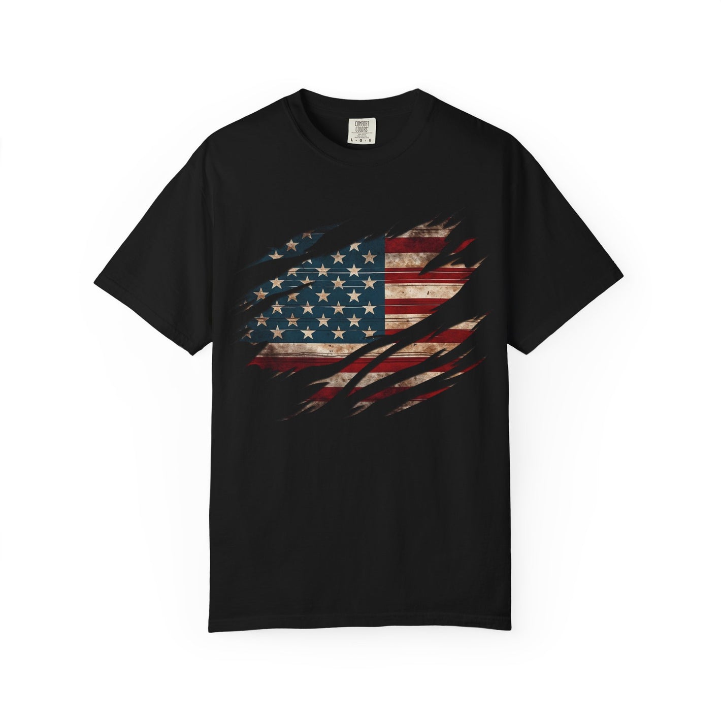 The “Torn Patriot” Distressed American Flag Comfort Colors Tee features a rugged flag graphic with claw mark slashes, shown laid flat on a white background.