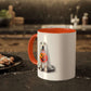 The 11oz Ghostly Pup Halloween Mug features a charming dog-ghost illustration with a pumpkin basket on a white mug with a red handle and interior, resting on a dark marble kitchen countertop next to nuts. Perfect for seasonal cheer as your Spooktacular Coffee Companion!.
