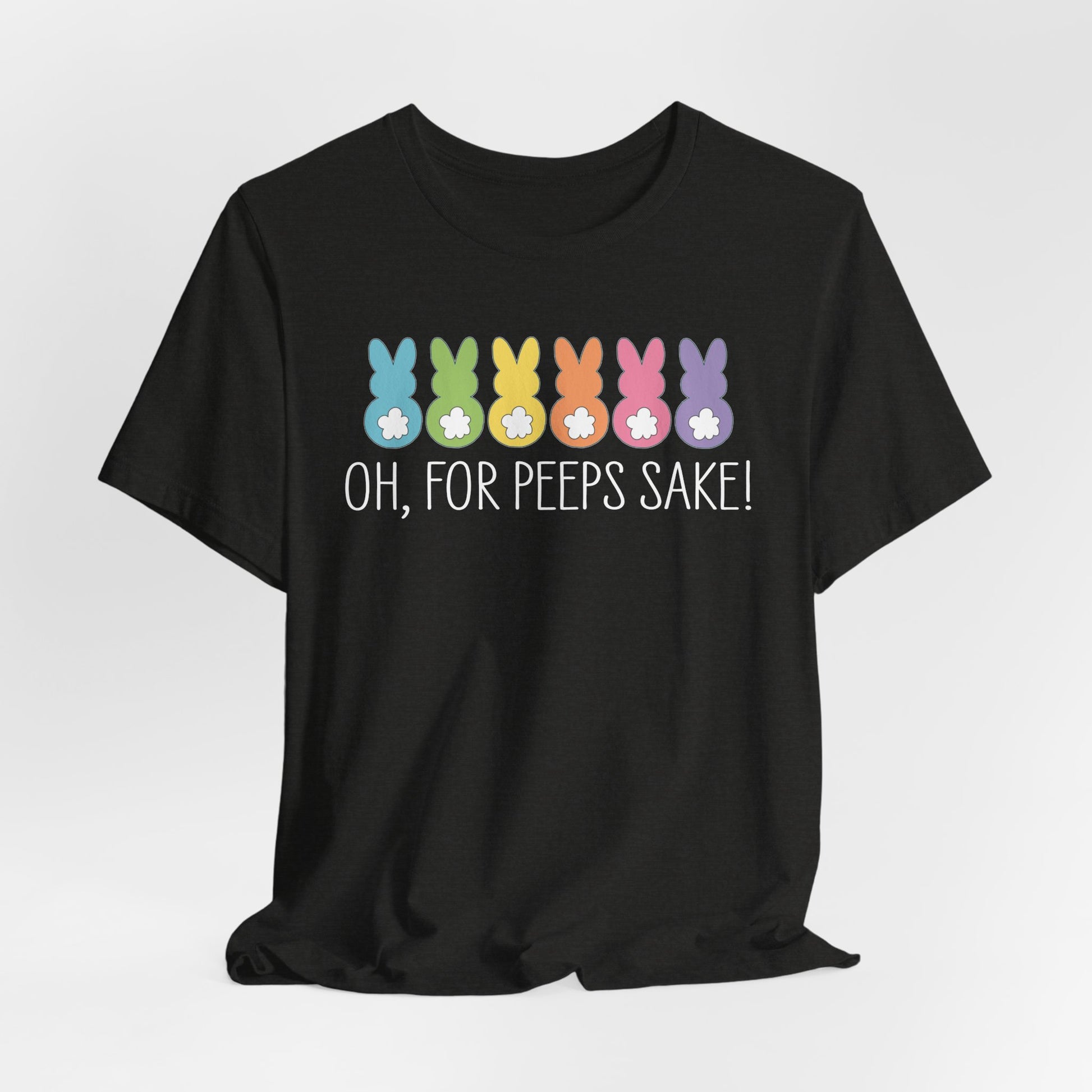 The Treat All Peeps with Kindness! black T-shirt, delicately crafted from soft Airlume combed cotton, features six colorful bunny silhouettes and the phrase Oh, for peeps sake! in white text. This unisex jersey tee is perfect for Easter fun and festive occasions.