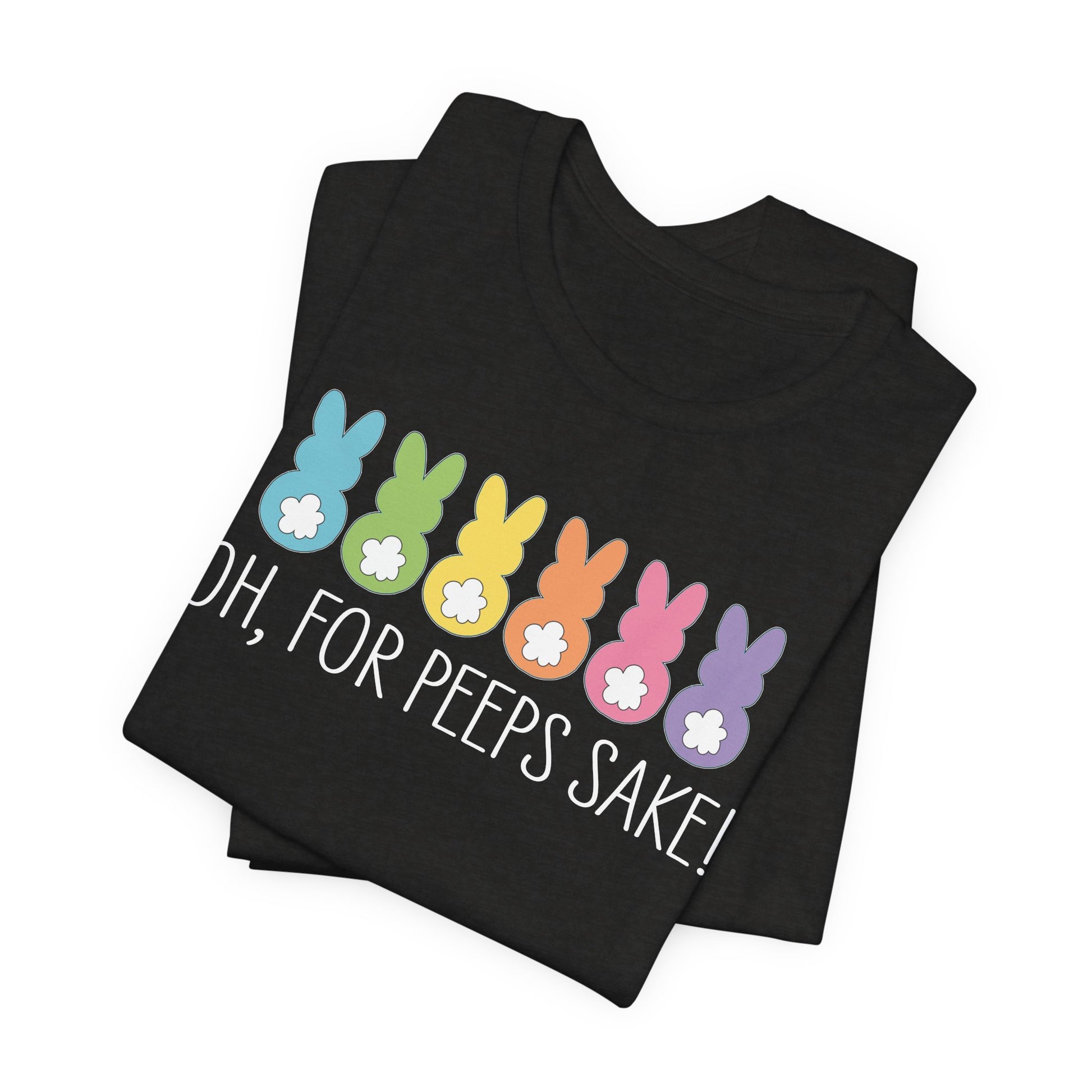 The Treat All Peeps with Kindness! unisex jersey tee, made from Airlume combed cotton, features a black base with pastel-colored bunny silhouettes and white cotton tails, highlighted by the bold white text OH, FOR PEEPS SAKE!. Ideal for Easter celebrations!.