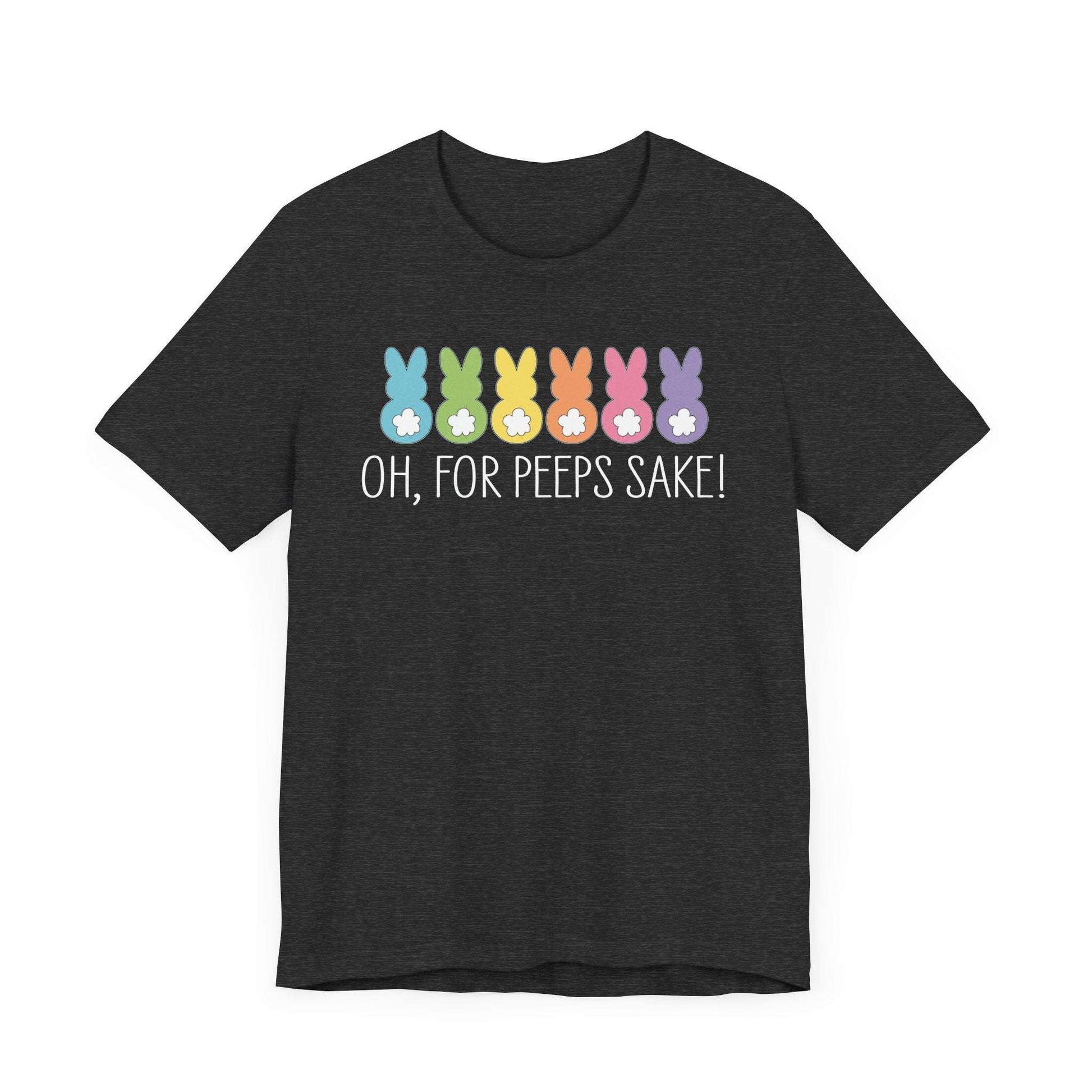 This unisex jersey tee showcases vibrant cartoon bunny silhouettes and white eggs on a dark gray background. Made from soft Airlume combed cotton, it features the phrase Oh, for Peeps sake! as part of its playful style, aligning perfectly with the Treat All Peeps with Kindness! Easter theme.