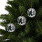 Round Christmas ornament featuring a black Bigfoot silhouette wearing a Santa hat, walking through a snowy forest scene.
