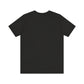The There Is No Spoon Minimalist Quote Tee is a black short-sleeve shirt, ethically made and displayed from the back on a white background.