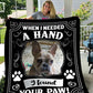 Custom pet blanket featuring a framed photo of a dog with the phrase "When I needed a hand, I found your paw!" in bold lettering, accented with paw prints.