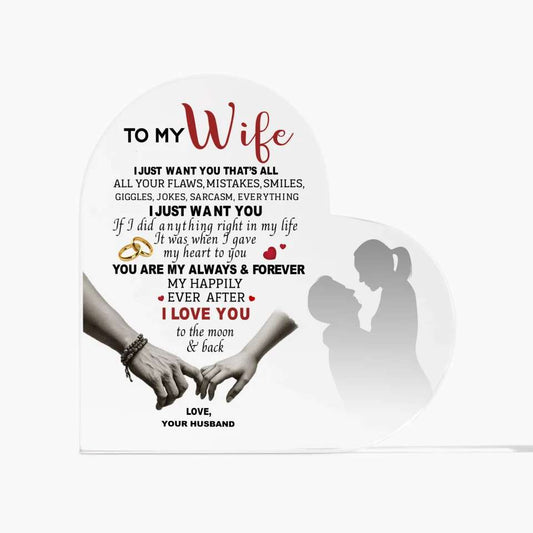 Heart-shaped acrylic plaque with a romantic message from a husband to his wife, featuring loving words, holding hands, and a silhouette couple design.