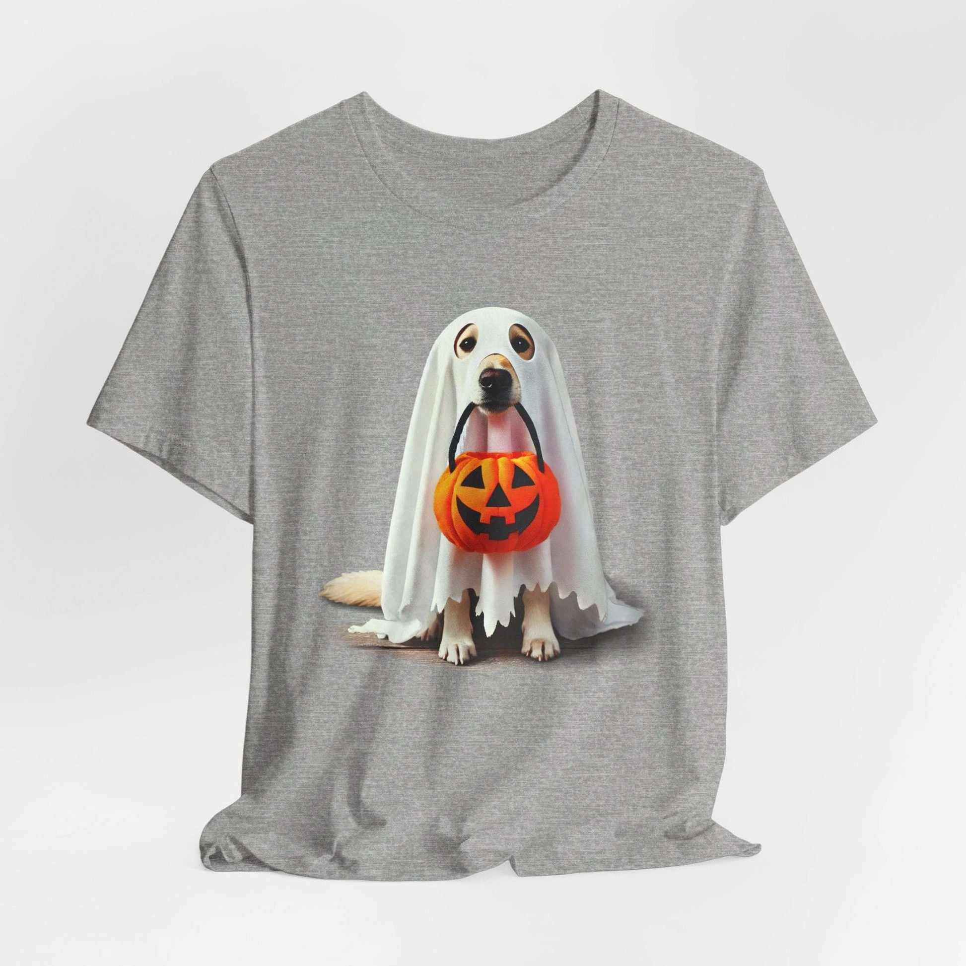 The Ghostly Pup Halloween T-Shirt features a playful ghost dog with an orange jack-o-lantern basket, perfect for those embracing spooky fashion.