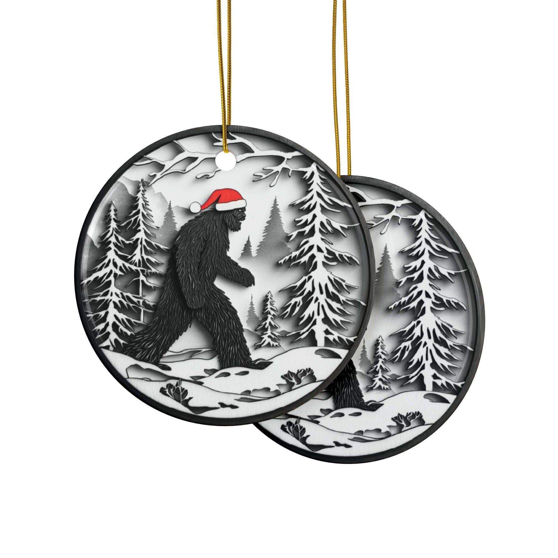 Round Christmas ornament featuring a black Bigfoot silhouette wearing a Santa hat, walking through a snowy forest scene.