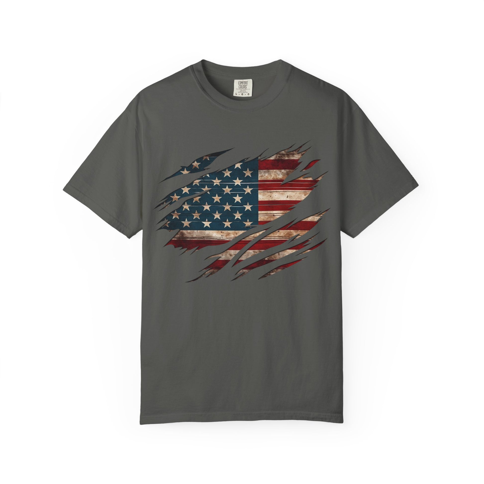 The “Torn Patriot” Distressed American Flag Comfort Colors Tee is a soft gray shirt made from US cotton with a weathered flag graphic showing through bold claw mark-style rips on the front.