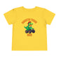 The Monster Truck Rex T-Shirt 🛻🦕 – Toddler Boys Tee is a yellow Bella+Canvas shirt with a green cartoon T-Rex driving a monster truck and MONSTER TRUCK REX in bold orange letters—perfect for any toddler dinosaur shirt collection.