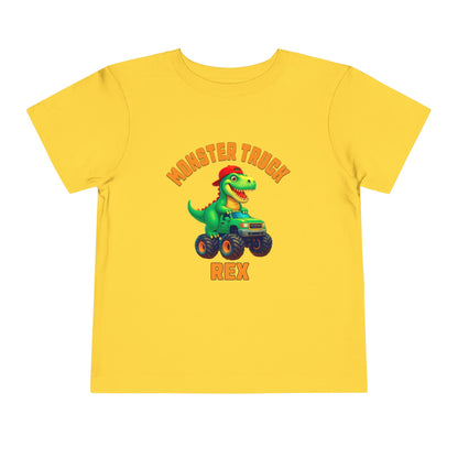 The Monster Truck Rex T-Shirt 🛻🦕 – Toddler Boys Tee is a yellow Bella+Canvas shirt with a green cartoon T-Rex driving a monster truck and MONSTER TRUCK REX in bold orange letters—perfect for any toddler dinosaur shirt collection.