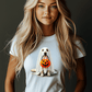 A long-haired blonde woman dons the Ghostly Pup Halloween T-Shirt - Adorable Trick or Treat Design, featuring a cartoon dog in ghost attire with a pumpkin bucket, set against a dark backdrop.