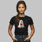 Against a gray background, a person with long hair wears the Ghostly Pup Halloween T-Shirt—a unisex jersey short sleeve tee featuring an adorable ghost dog holding a pumpkin bucket. This spooky design is perfect for the season!.