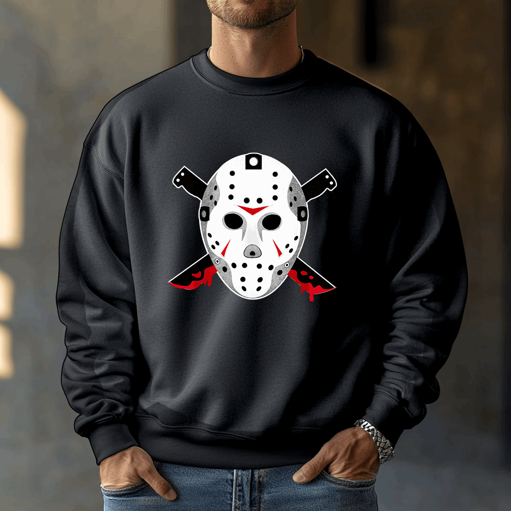 A person wears a black Voorhees 13 sweatshirt, featuring a hockey mask and crossed knives graphic with blood-red accents, perfect for horror fans. They stand indoors with their hands in the pockets of this Unisex Heavy Blend™ Crewneck Sweatshirt.