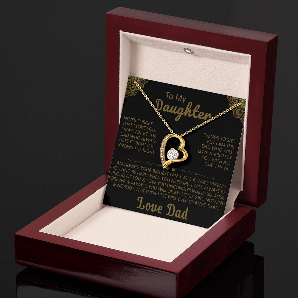 Gold heart-shaped pendant necklace with a sparkling crystal, displayed in a wooden gift box with a heartfelt message from a father to his daughter.