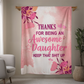 Pink floral-themed blanket with a bold, humorous message thanking an awesome daughter.
