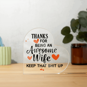 Heart-shaped acrylic plaque with a bold, humorous message thanking an awesome wife, accented with orange hearts.