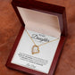 The To My Daughter: Forever Connected Message Card & Love Knot Necklace Set features a gold heart-shaped pendant with a central cubic zirconia, beautifully displayed in an open wooden box with a heartfelt message on the inside lid.