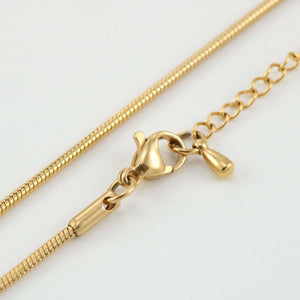 Close-up of the Replacement Attachment shows a lobster clasp and adjustable chain extender, offering versatility against a plain white background.
