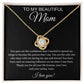 The To My Beautiful Mom Cubic Zirconia Love Knot Necklace features sparkling stones in a 14k white gold finish, displayed in a gift box with a heartfelt message card on a black background, perfect for birthdays or Mothers Day.