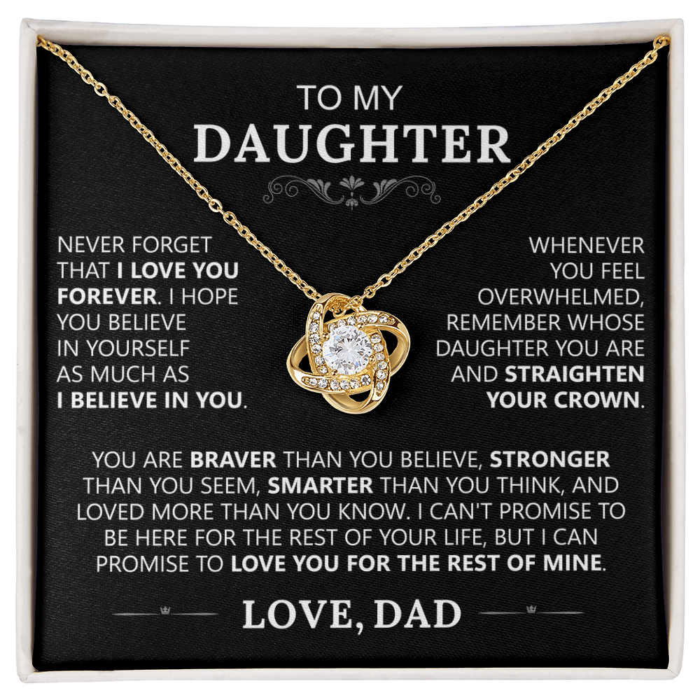 The To My Daughter - Love Knot Necklace in 14k white gold with a sparkling center stone is displayed in a box featuring a heartfelt message from dad about love, strength, and self-belief—an ideal father-daughter gift.