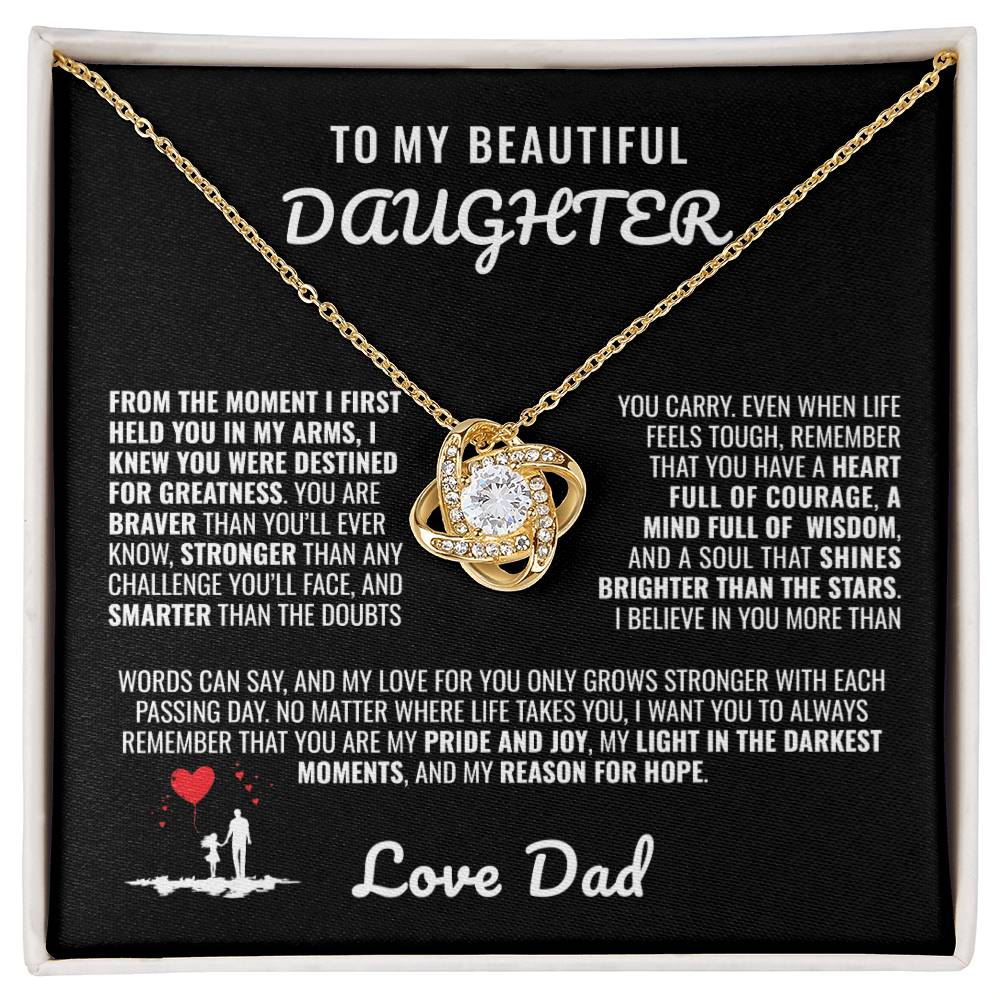 Elegant silver love knot necklace with a sparkling crystal, displayed in a black gift box featuring a heartfelt message from a father to his daughter.