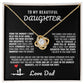 Elegant silver love knot necklace with a sparkling crystal, displayed in a black gift box featuring a heartfelt message from a father to his daughter.