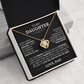 The To My Daughter - Love Knot Necklace features a gold knot pendant in a black box. Inside the lid is a heartfelt message from a father to his daughter about love, support, and encouragement, ending with “LOVE, DAD.”.