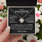 A hand holds an open box with the To My Daughter - Love Knot Necklace inside. The lid displays a heartfelt father-to-daughter message, symbolizing their lasting bond, against a background of pink and white flowers.
