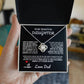 Elegant silver love knot necklace with a sparkling crystal, displayed in a black gift box featuring a heartfelt message from a father to his daughter.