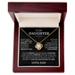The To My Daughter - Love Knot Necklace features a shiny pendant in a wooden jewelry box. Inside, a heartfelt message from dad celebrates your unbreakable bond, love, and strength—a perfect father-daughter gift.