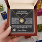 Gold love knot necklace with a sparkling crystal, presented in a gift box with a heartfelt message from a mother to her daughter