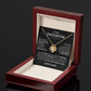 The To My Daughter - Love Knot Necklace is shown in an open red jewelry box, featuring a loving message from Dad inside the lid that celebrates an unbreakable bond—making it the perfect father-daughter gift.